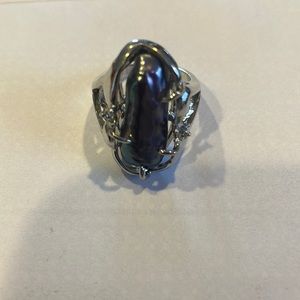 Large fashion ring with piece is iridescent shell.  Size 6